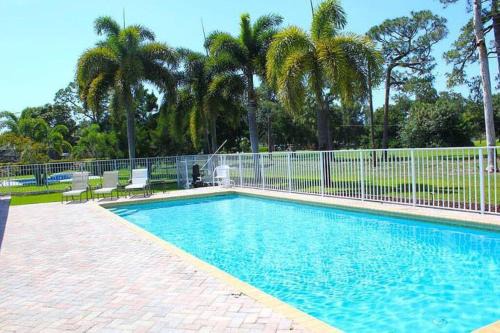 Lake Worth House | Golf course view & heated pool home