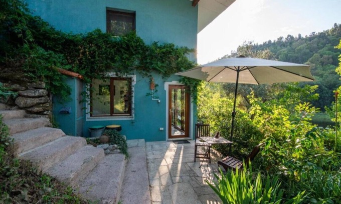 Currelos Apartment | Granite-wall Luxury Cave on the Mondego River