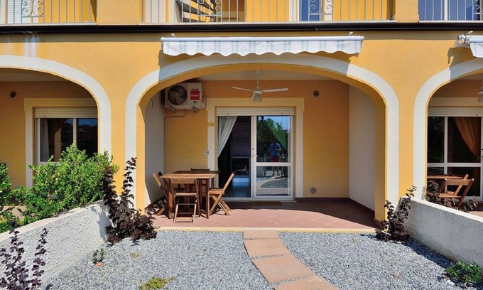 Pizzo Apartment | Green Bay; a comfortable one-bedroom ground floor apartment with communal pool