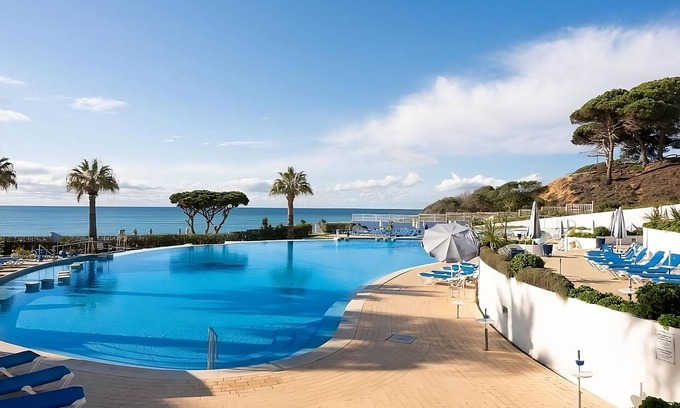 Oura Hotel | Group Getaway in Oura Beach! Four Sea View Units, Swimming Pools, Beachfront!