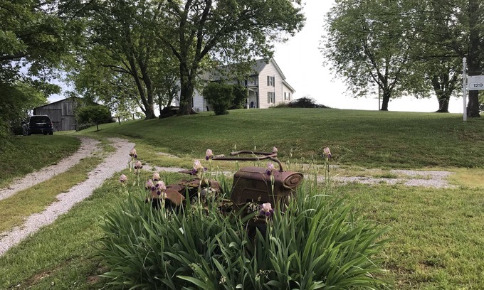 Carlisle House | Hilltop Farmhouse with sunrise sunset porch overlooking hills and holler