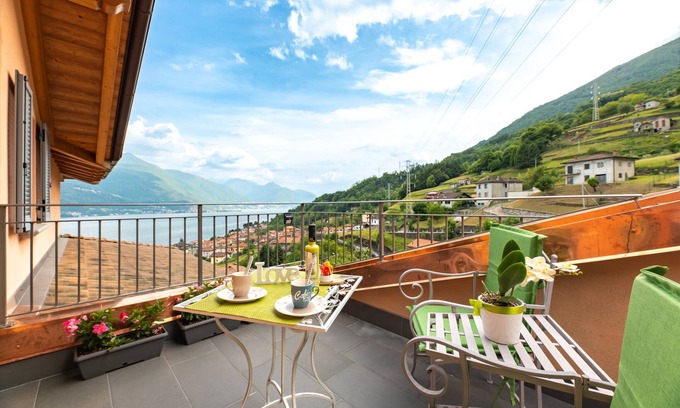 Musso Apartment | Holiday Apartment "Orchidea Terrazzo Sul Tetto" with Balcony, Shared Pool & Wi-Fi