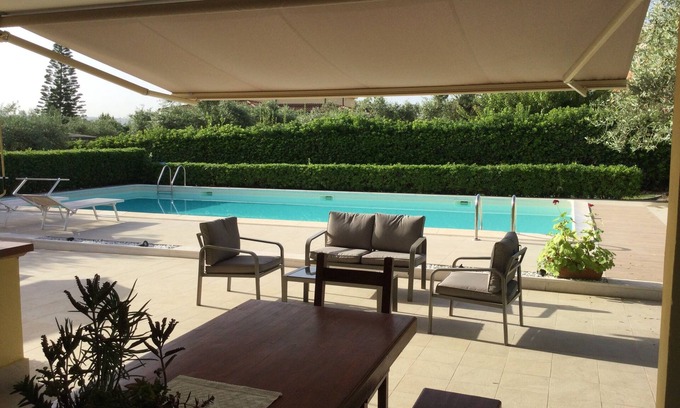Sassari House | Holiday home in the countryside with a swimming pool, surrounded by greenery.