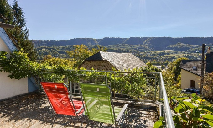 Vic-sur-Cere House | Holiday Home in Vic-sur-Cère with Balcony