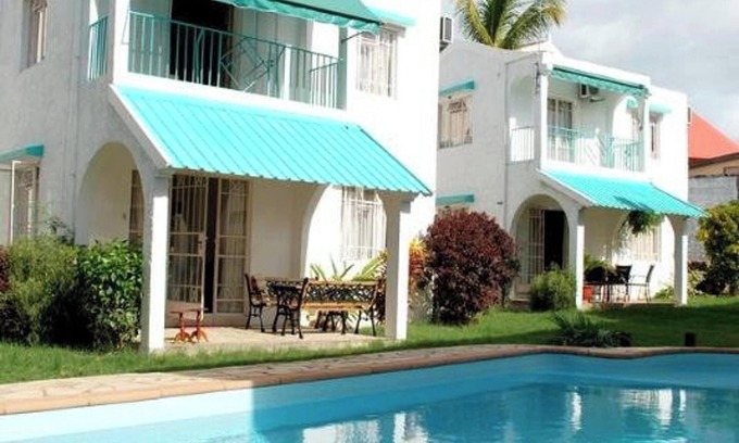 Flic-en-Flac House | Homerez - Spacious House in Flic en Flac with Shared Pool
