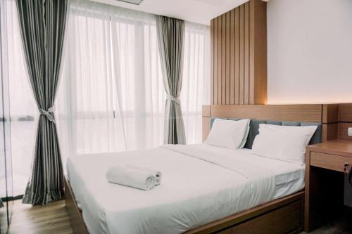 Pinang Apartment | Homey and Comfortable 1BR at The Smith Alam Sutera Apartment By Travelio