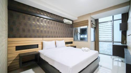 Surabaya Apartment | Homey and Cozy Living 2BR Apartment at Aryaduta Residence Surabaya By Travelio