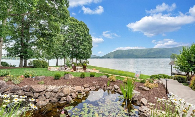 Huddleston House | Hook & Paddle - Luxury home on SML with kayaks and private dock.