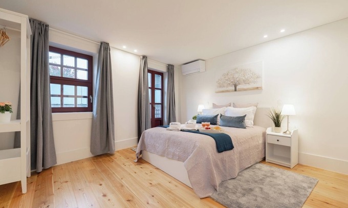 Guimaraes Apartment | HostWise - Sunny Flats w/Balcony