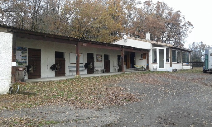 Pailloles House | House in a rural setting with horses nearby