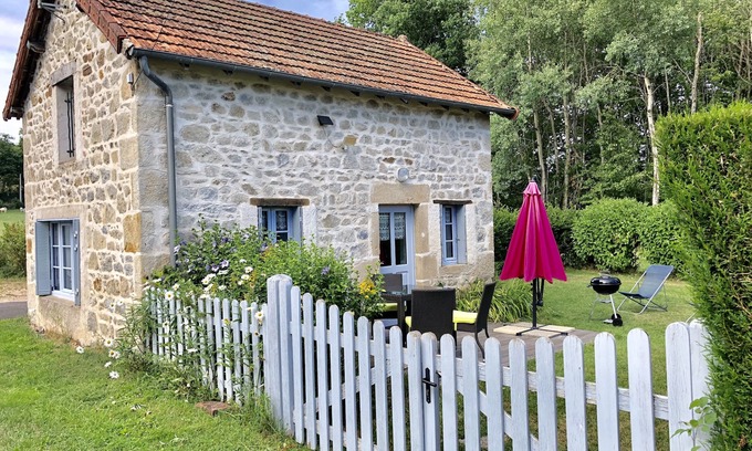 Gouttieres House | House made of regional stones, typical from Auvergne, greenery landscape