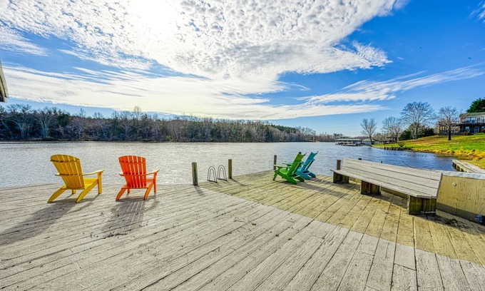 Louisa House | Huge lakefront home with A/C, sunroom, boat ramp, WIFI,game room, deck, & kayaks