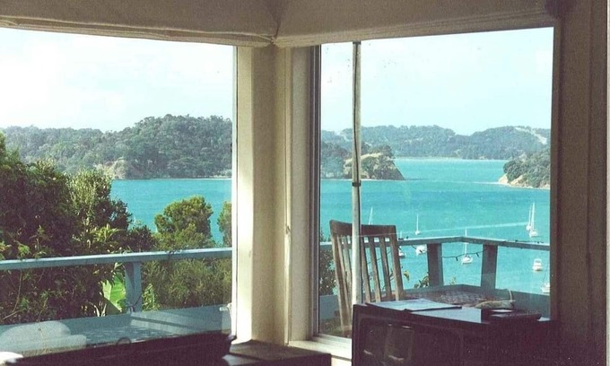 Mahurangi West Cottage | Iconic New Zealand beach cottage with elevated harbour and bush views.