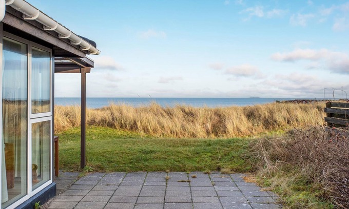 Strandby House | In the 1st row of dunes and with sea view to the Kattegat, this bright and cozy vacation home in Str