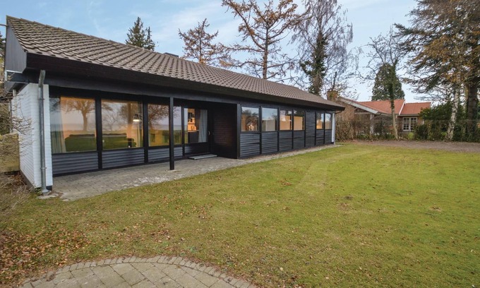 Faxe Ladeplads House | In the first row to the water lies the cozy cottage.