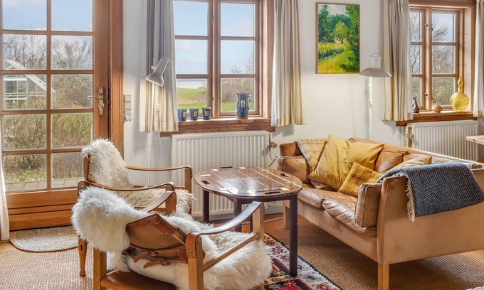Bog By House | In the heart of Bogø Island, this beautiful thatched house welcomes you with authentic charm.