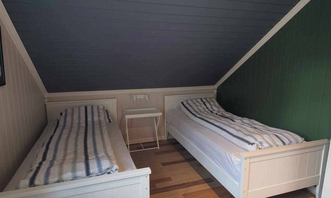 Sarpsborg House | Island house room Shared entrance with hosts Two single beds + sofa bed Small kitchen