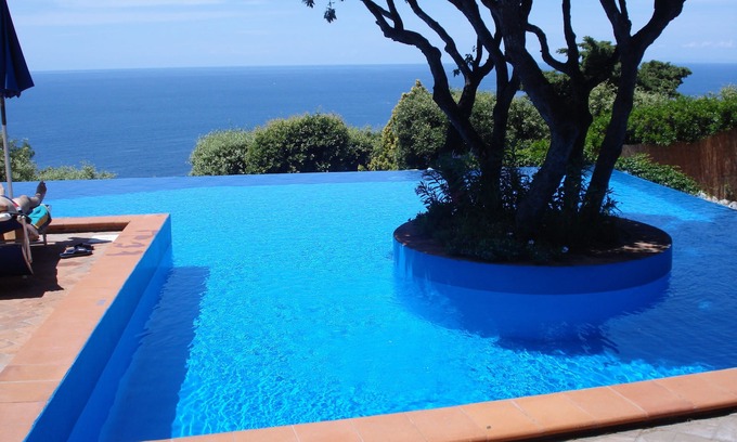 Cala Piccola Apartment | Relax and sea: one room with patio and pool