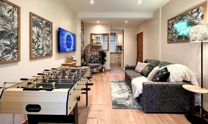 Rhondda Cynon Taff Apartment | Joyful Jungle Jewel w/Balcony & Foozeball-Ferndale
