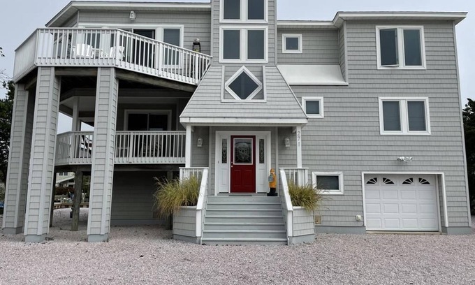 Loveladies House | Lagoon front. Loveladies. Dock. Decks. Beach Badges. Bikes. Ping Pong table.
