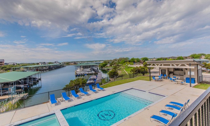 Graford Condo | Lake front Condo 2BD/2BA w/pool, hot tub, fire pit, gas grills, gym, & laundry.