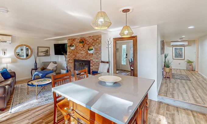 Maple Heights-Lake Desire Apartment | Lake view suite with beautiful setting, fireplace, firepit & tree-lined patio