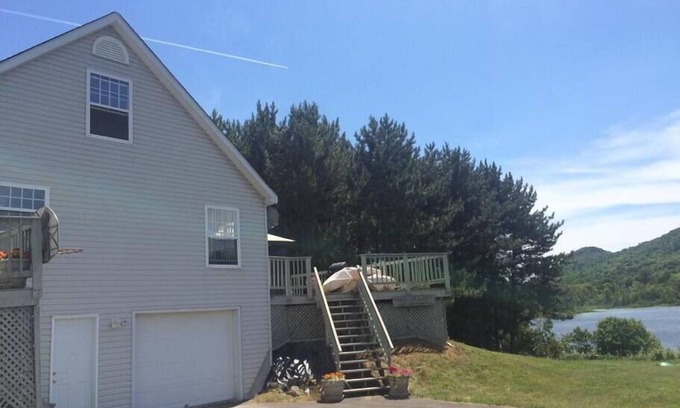 Presque Isle House | Lakeside Luxury, 4 bedrooms, 2 bath, sleeps 10. Outdoor Grill, Kayaks, Firepit.