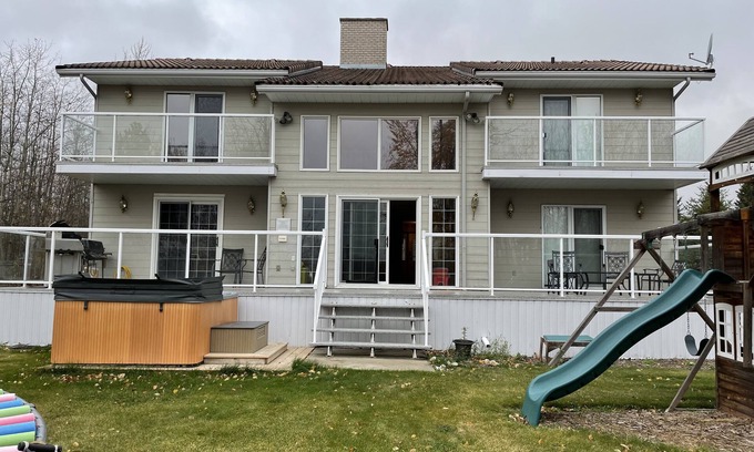 Sherwood Park House | Large family or group vacation lake home with dock and boats 35 minutes from WEM