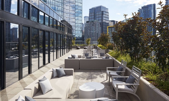South Lake Union House | Level Seattle - Well Appointed Deluxe One Bedroom Suite + Office. Full Epicurian Kitchen and in suite laundry.
