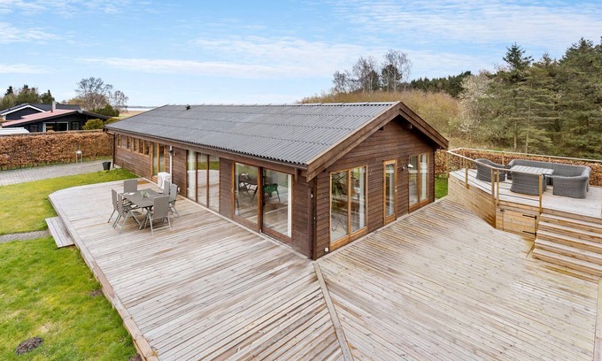 Skibby House | Look forward to this light-flooded and beautiful vacation home with a spacious wooden terrace.
