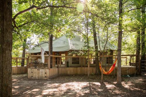 Dennis House | Luxurious African tent wwaterfall on the Brazos River! 350 acres! Tubing! Petting Zoo!