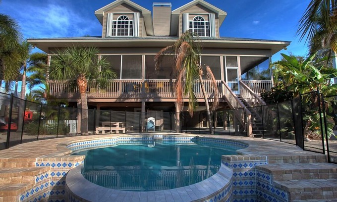 Palm Island House | Luxury 4 Bedroom pool home close to beach, private dock on Kettle Harbor.
