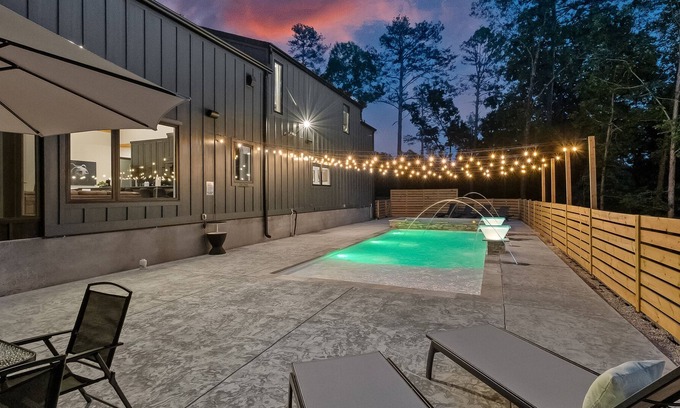 Rogers Cabin | Luxury cabin lined by trees with pool, oversized sunroom, hot tub & grill