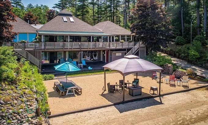 Milton House | Luxury Lakehouse with Large Private Beach, Hottub, Tiki Bar, 100’ Covered Deck, and Dock