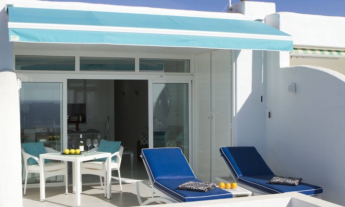Puerto del Carmen Apartment | Luxury one bedroom apartment, private terrace, ocean views, full UK TV, WiFi