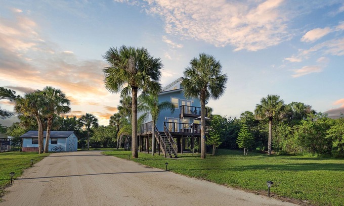 Cocoa House | Luxury Stilt Beach House in the Woods! 3/2.5 w/ Stocked Pond & Oasis on 1 ACRE!