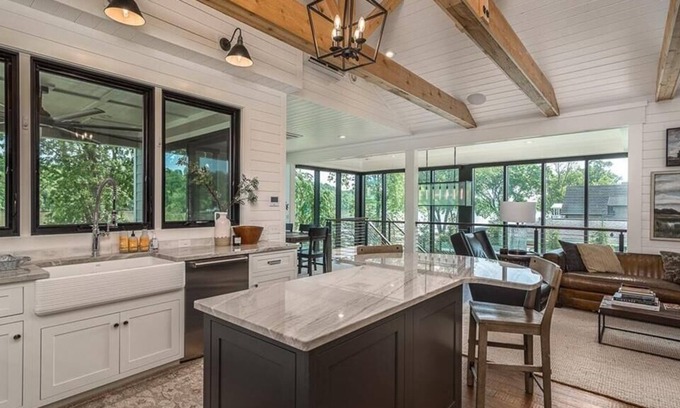 Otisco House | Luxury waterfront home. Fireplaces, patios & views