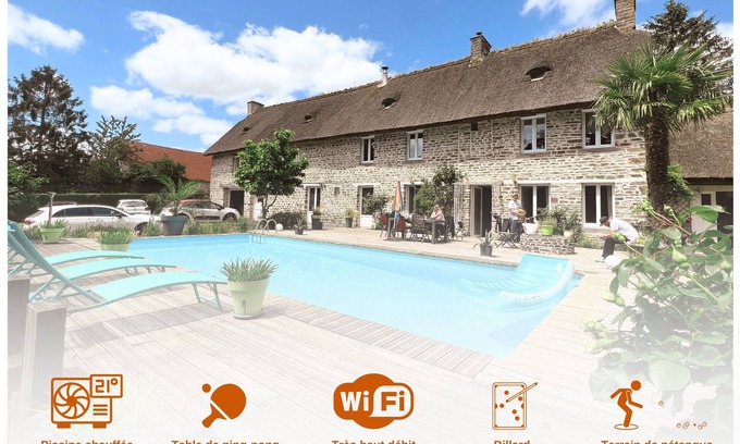 Conde-sur-Noireau Villa | Magnificent stone villa with thatched roof and heated swimming pool
