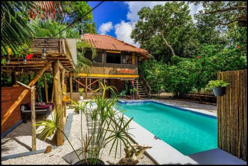 Matapalo House | Matambú Rancho Rustic 2bd Apt with Shared Pool