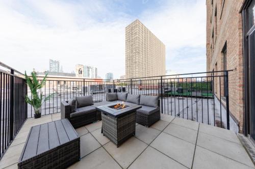 Near South Side Apartment | McCormick Place 2BR Suite with Patio, Skyline View and Optional Parking Sleeps 6 Near Soldier Field and Grant Park
