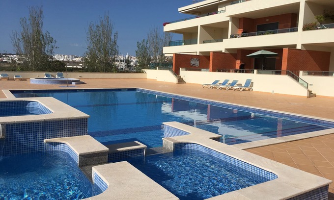 Lagos Apartment | Meia Praia Poolside Apartment. 500 Mbps WiFi. Tourist Licence 39739/AL