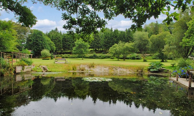 Mount Cottage | Millpool Lodge peaceful haven with 3 acre stunning gardens waterfalls and hottub