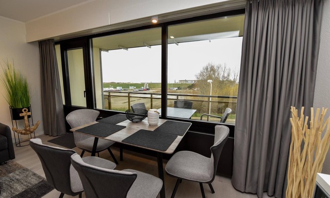 Duhnen Apartment | Modern 1-room lake view apartment on the 2nd floor with balcony