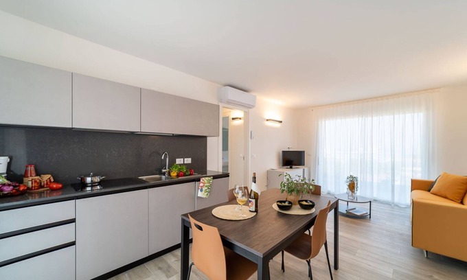 Lignano Sabbiadoro Apartment | Modern apartment with solarium and panoramic lagoon and seaview