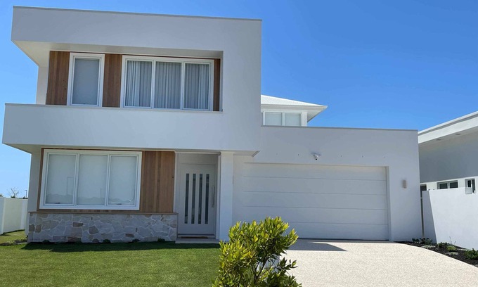 Pelican Waters House | Modern Boho Retreat with Pool, Yard & Beaches Just Minutes Away