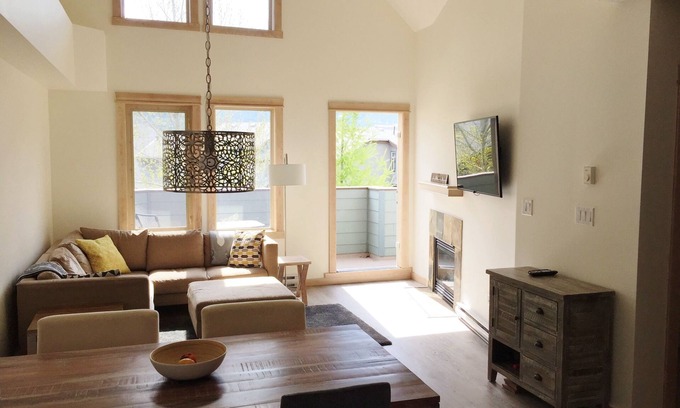 Canmore Condo | Modern, rustic mountain view loft style condo with pool, hot tubs & XL beds.