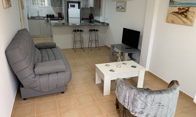 Lomas Apartment | Modern south facing Apartment with Sun Terrace 10 minute walk to sandy beach.