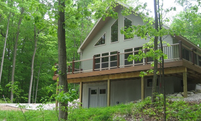 Frankfort House | Modern, secluded house with Crystal Lake views on a forested ridge