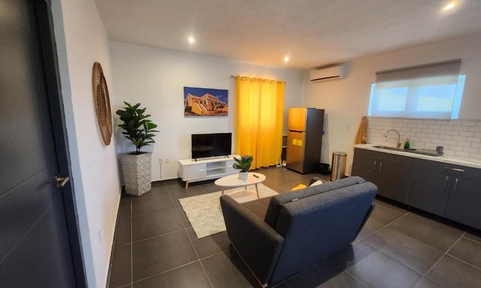 Tera Kora Apartment | Modern sunshine yellow apartment with nature views