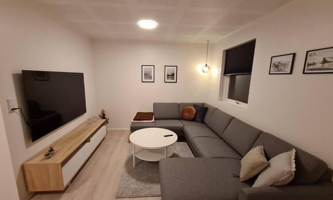 Torshavn Apartment | Modern unit with a king-size bed and a bathtub